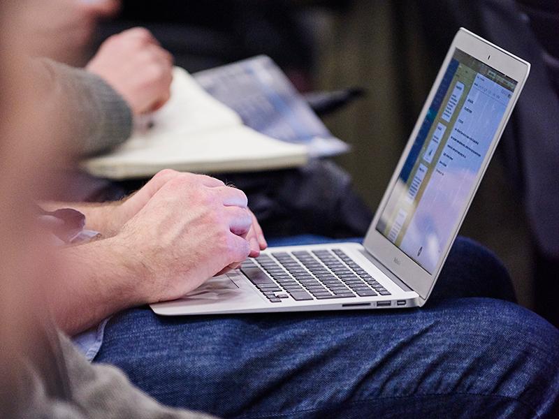 Exhibitor on laptop at event