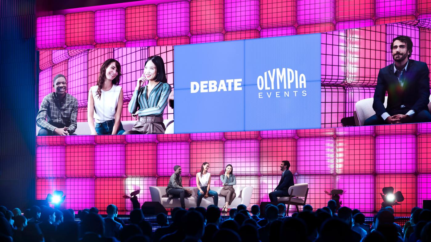 An image showing 'Panel discussion at Olympia Conference Centre'