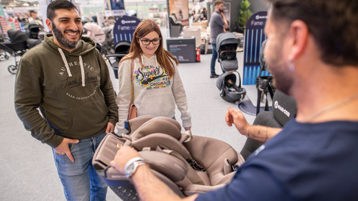 People gathered around a baby seta display at The Baby Show