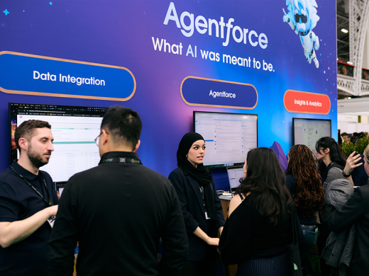 People engaging in conversation at exhibition stands