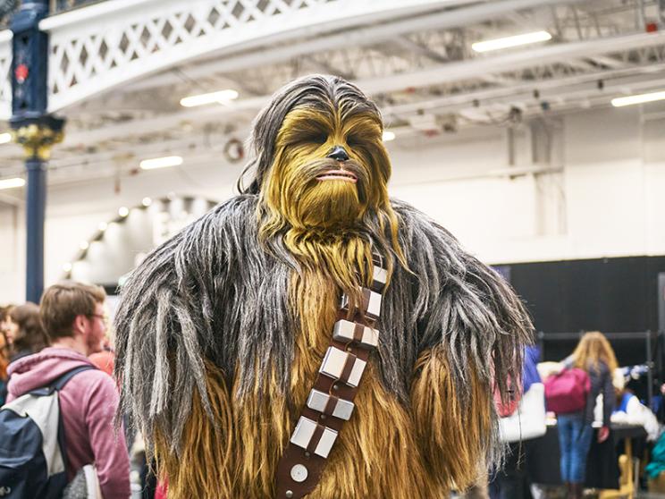 A cosplayer dressed up as Chewbacca.