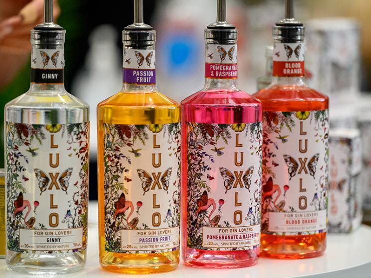 A row of colourful drink bottles.