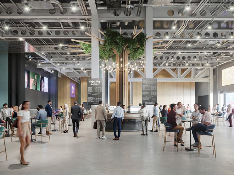 Rendered image of a modern conference breakout space with a central coffee bar, digital screens, greenery, and groups of people socialising.