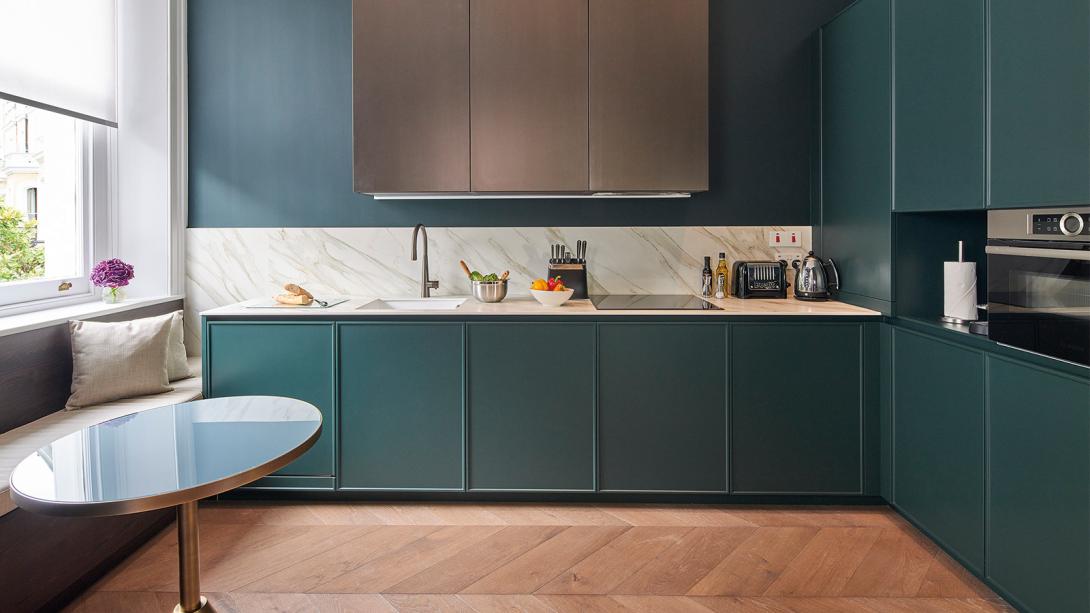 Kitchen in apartment at Lexham Gardens by Cheval Maison