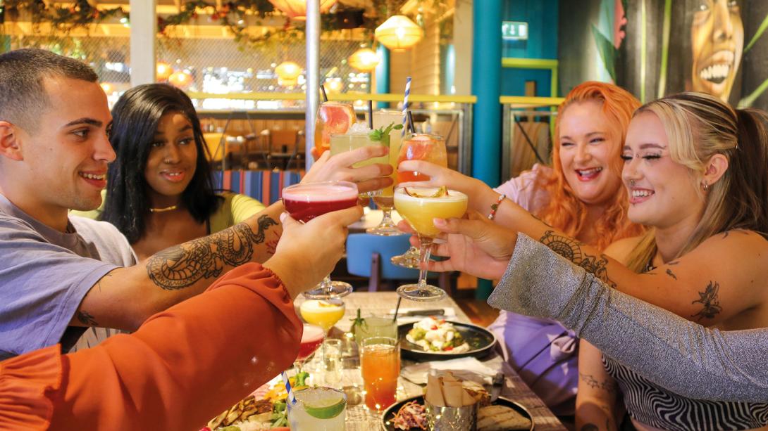 People enjoying food and drinks at Turtle Bay