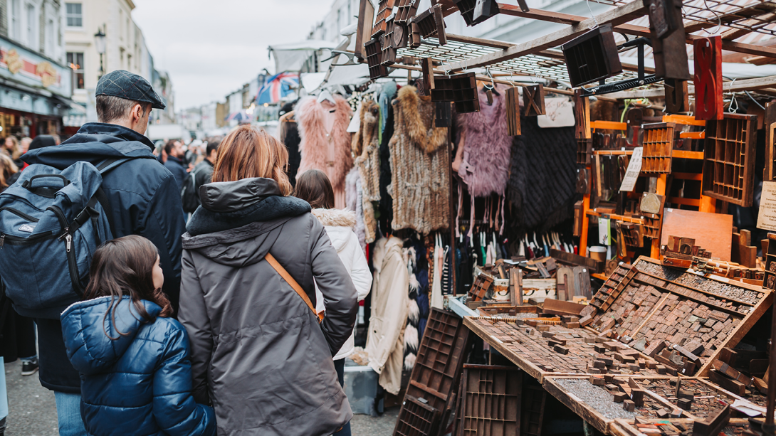 People looking at a stand on Portobello Road