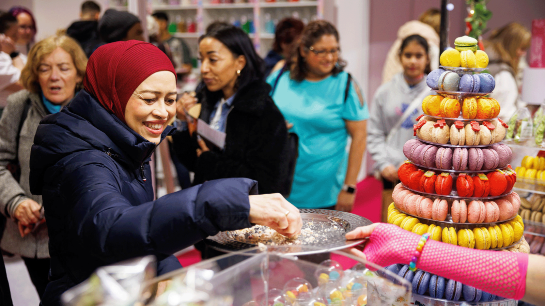 A woman exploring a range of baked goods.