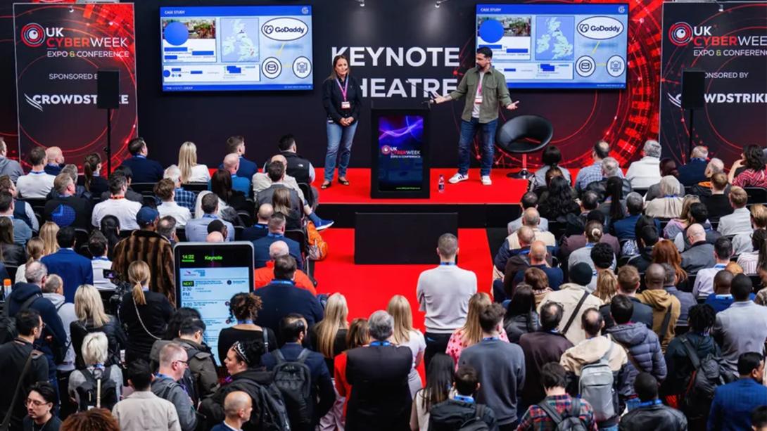 A speaker delivering a keynote address at a conference.