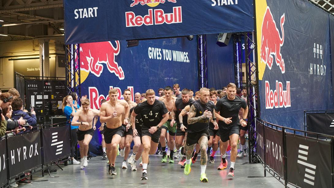 A group of men sprinting energetically, showcasing excitement and competition.