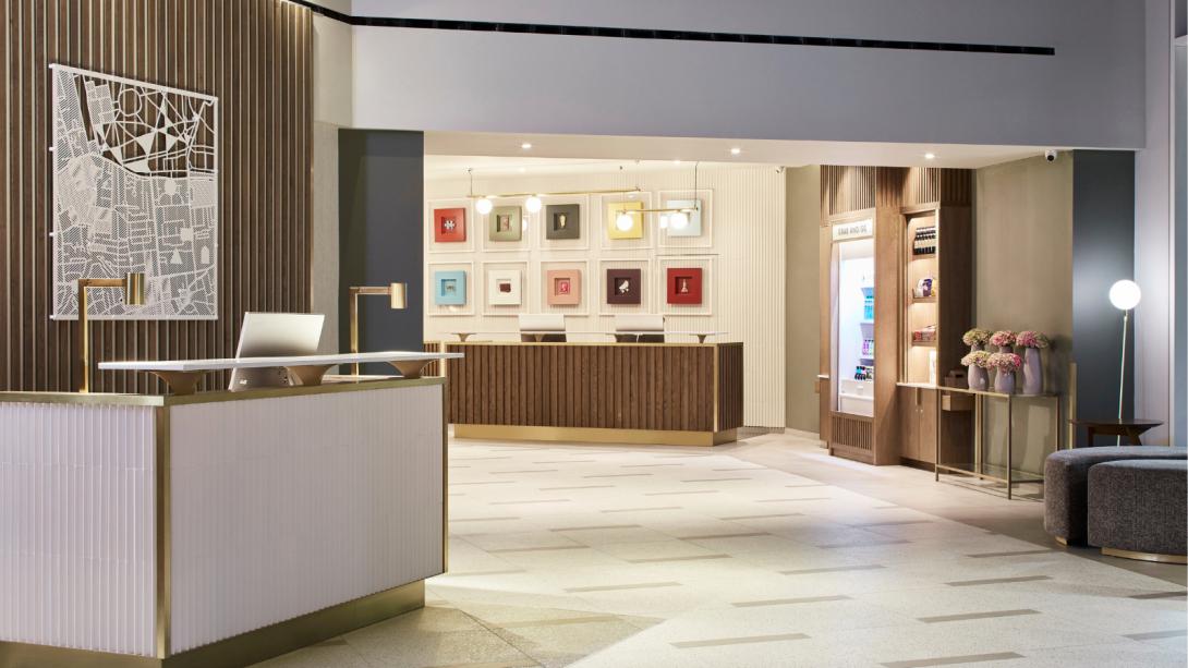 A welcoming hotel lobby showcasing a reception desk and comfortable seating areas.