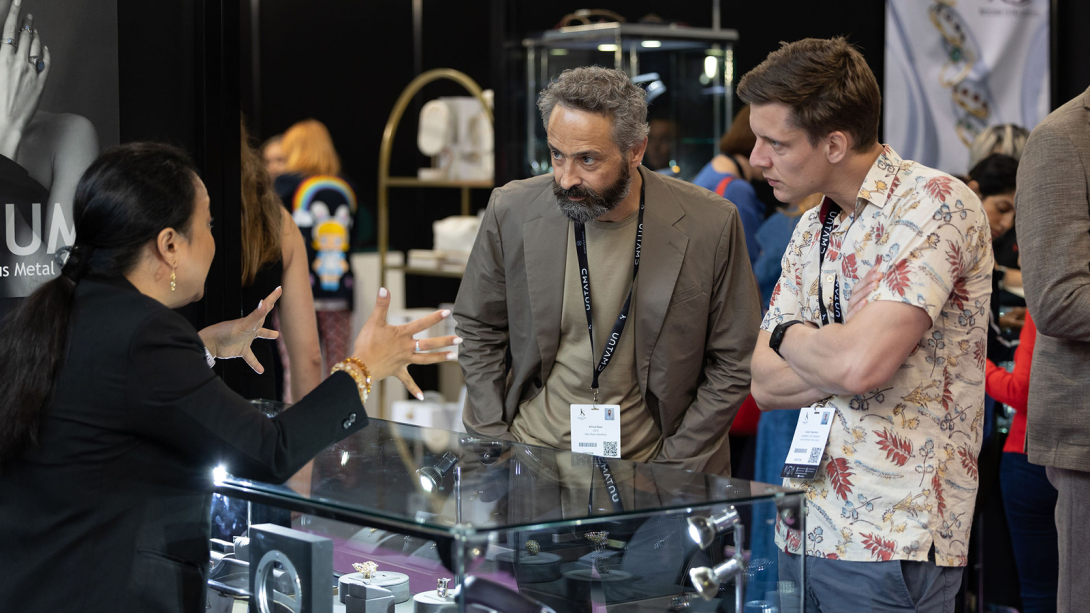 Suppliers talking to visitors at their exhibition stand at Thew Jewellery Show 