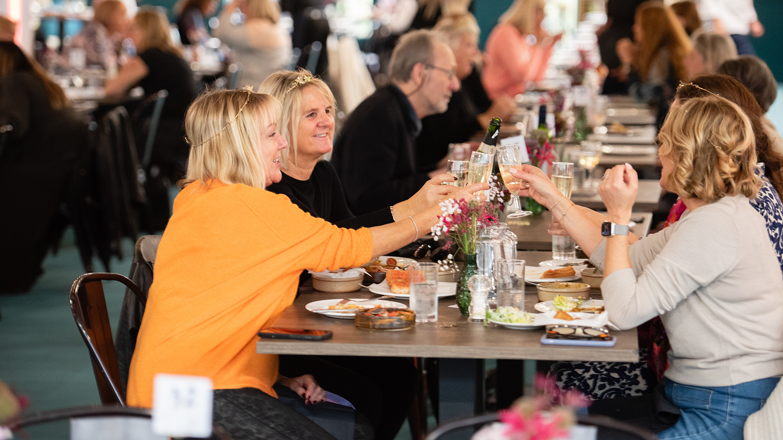 A group of people enjoying the dining experience at Spirit of Christmas