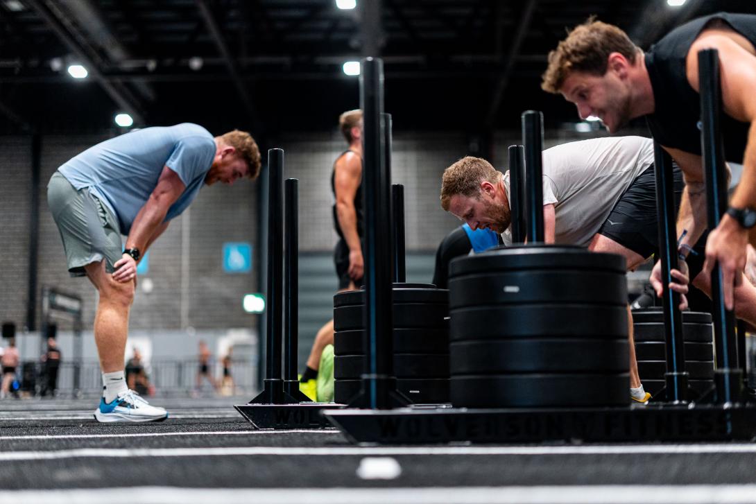 A group of people competing in weight training at Hybrid Games