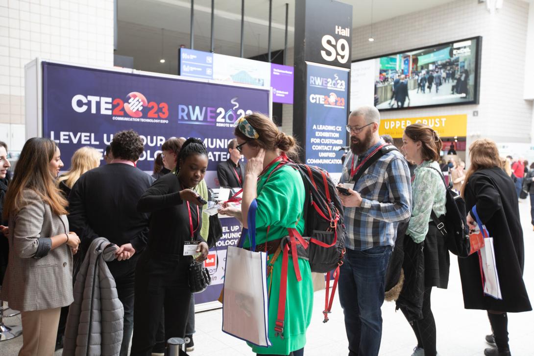 People gathered round an exhibitor stand